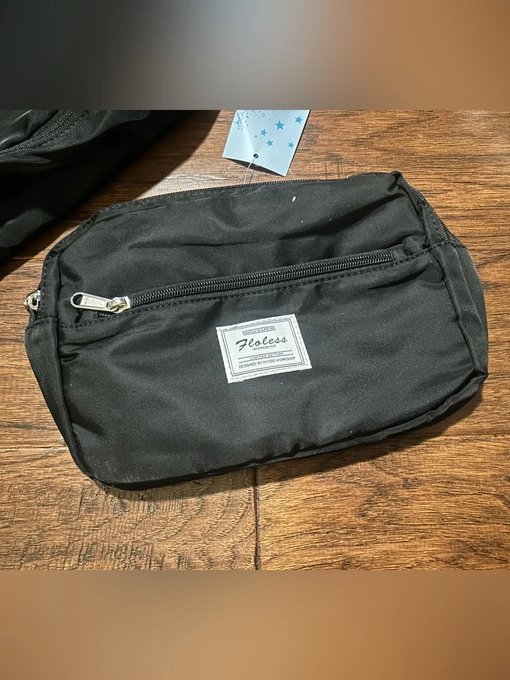 black Floless Workshop limited edition duffel bag with toiletry bag